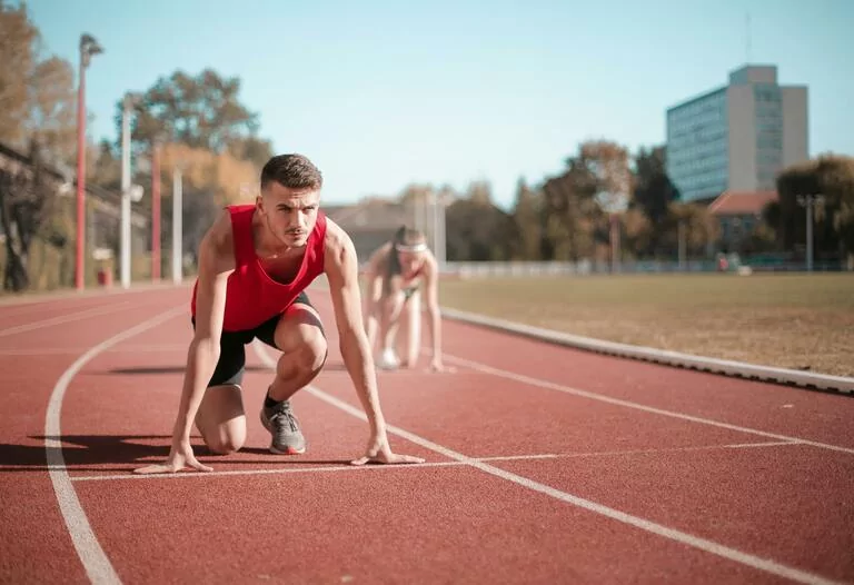 Runners ready to run on stadium track